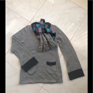 Girl’s sweater with scarf.